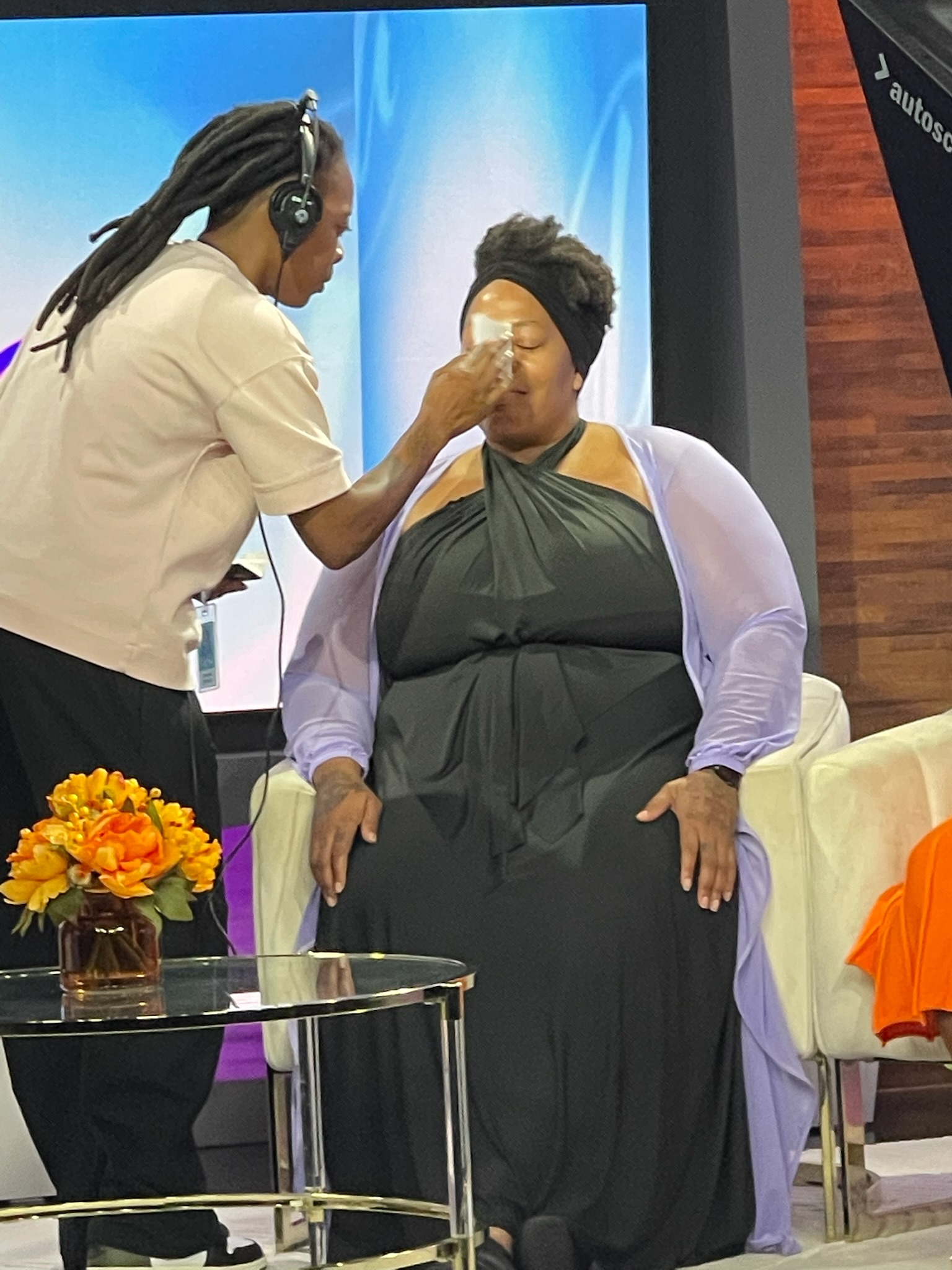 Nicole S. Palmer having her makeup touched up before going on air